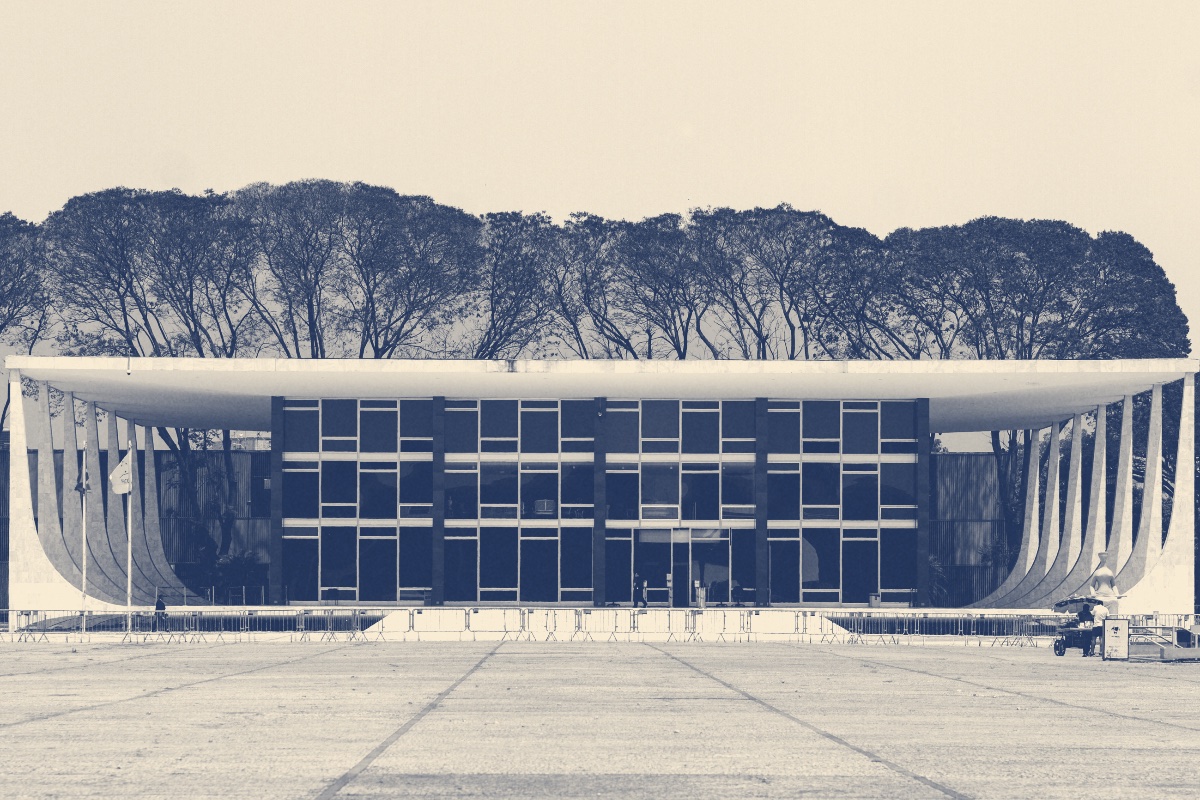 The Supreme Federal Court building in Brasília across an empty paved square, a low glass block under a flat roof held up by curved white columns, a line of trees behind, in a slate and bone duotone