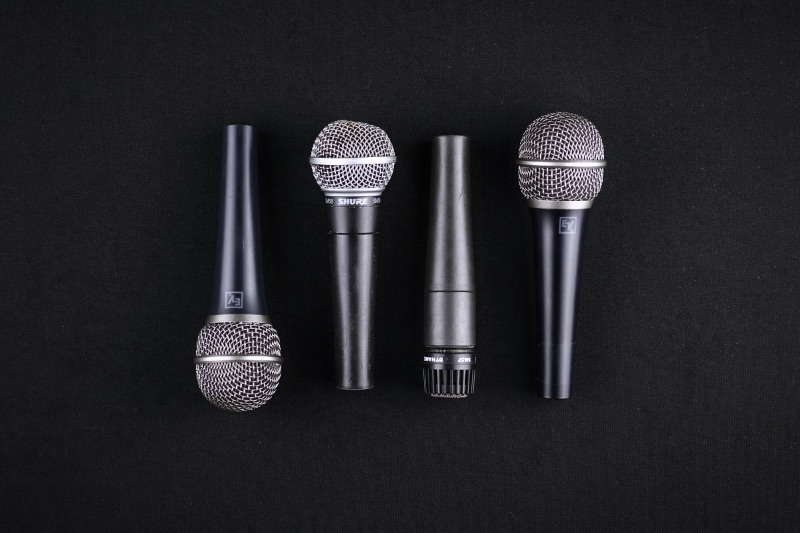 Four black microphones