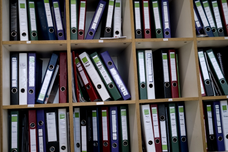 Shelves filled with colorful binders and folders