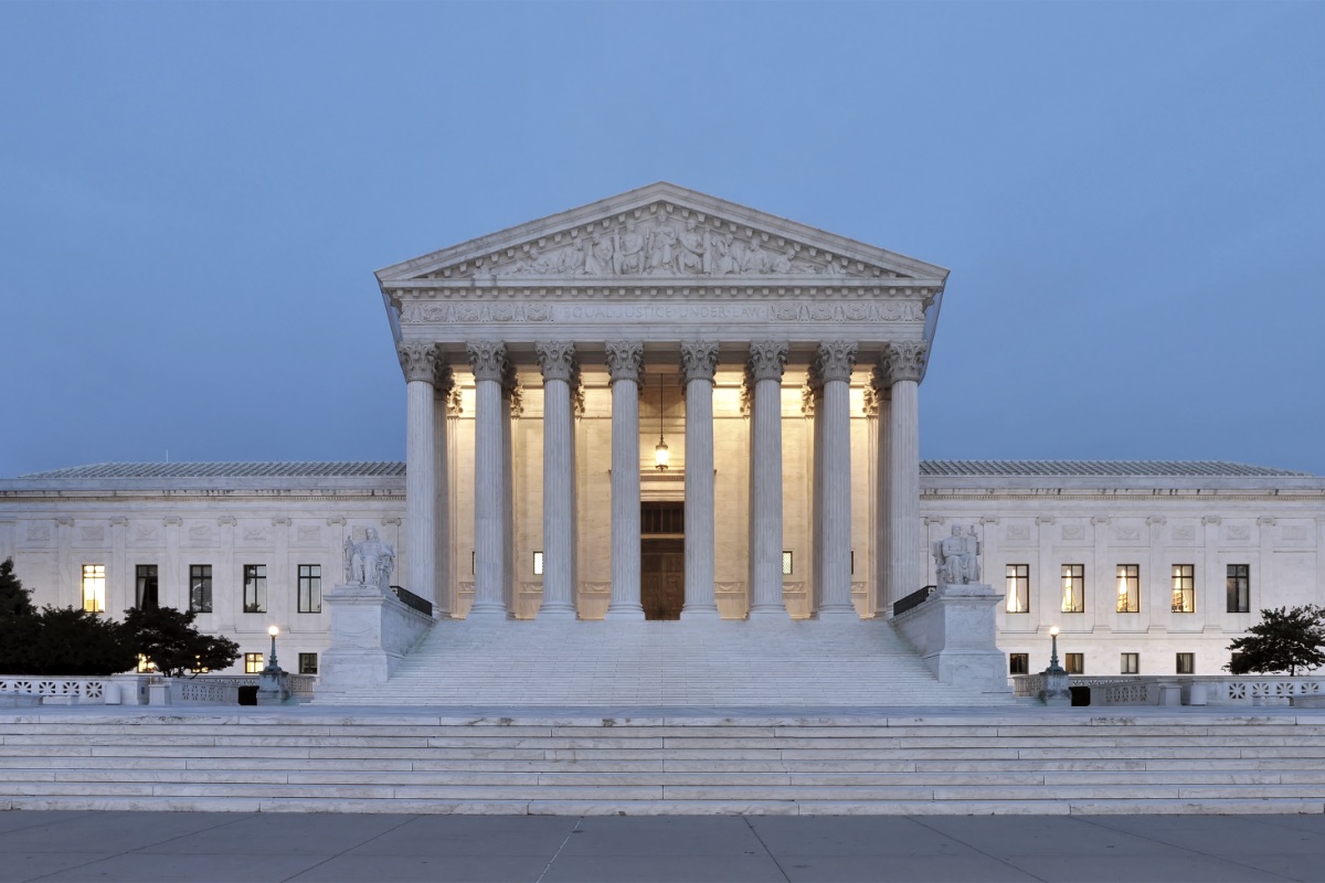 The west facade of the United States Supreme Court building at dusk