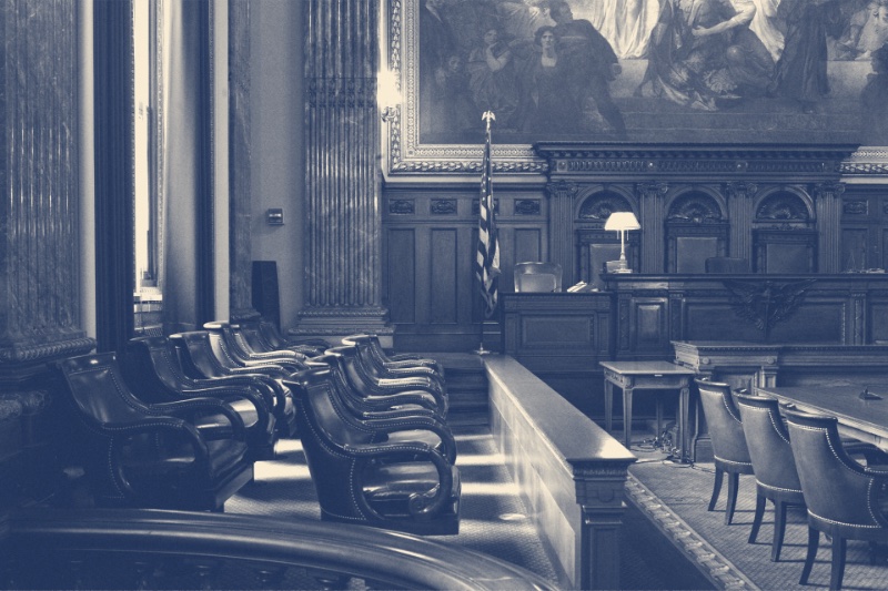 The jury box and bench of a United States federal courtroom