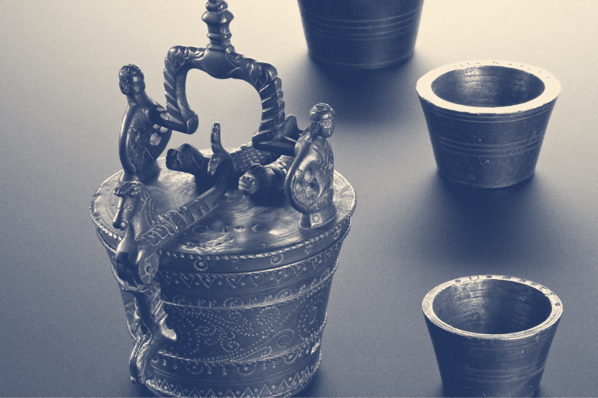A set of seventeenth century nested brass weights, in a blue duotone