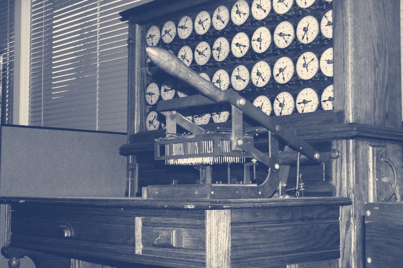 A bank of counting dials on a nineteenth century census tabulating machine, in a blue duotone
