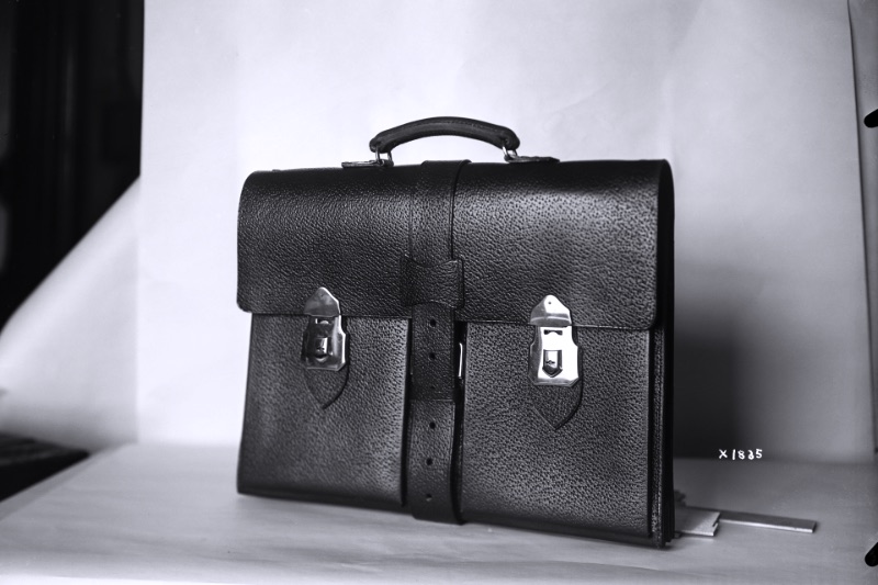 A leather briefcase photographed against a plain ground