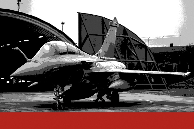 A French Air and Space Force Rafale jet parked outside an open hardened aircraft shelter, in near black and white with a red bar along the foot