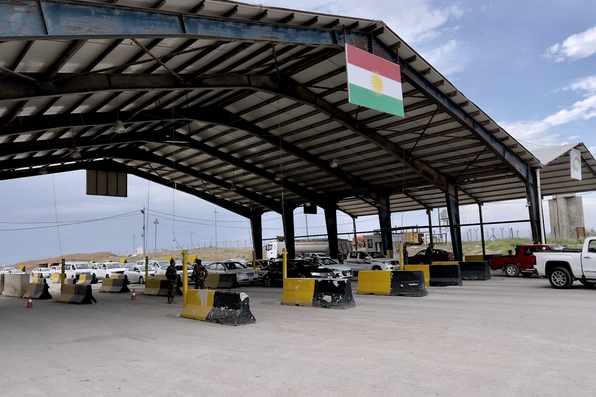 Border crossing with kurdistan flag under shelter