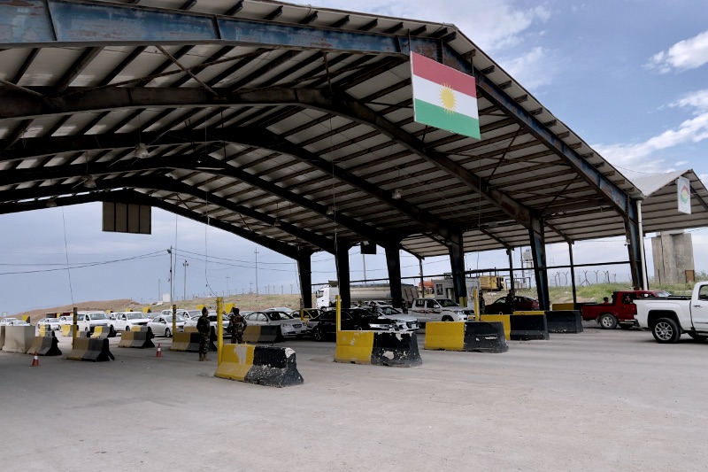 Border crossing with kurdistan flag under shelter