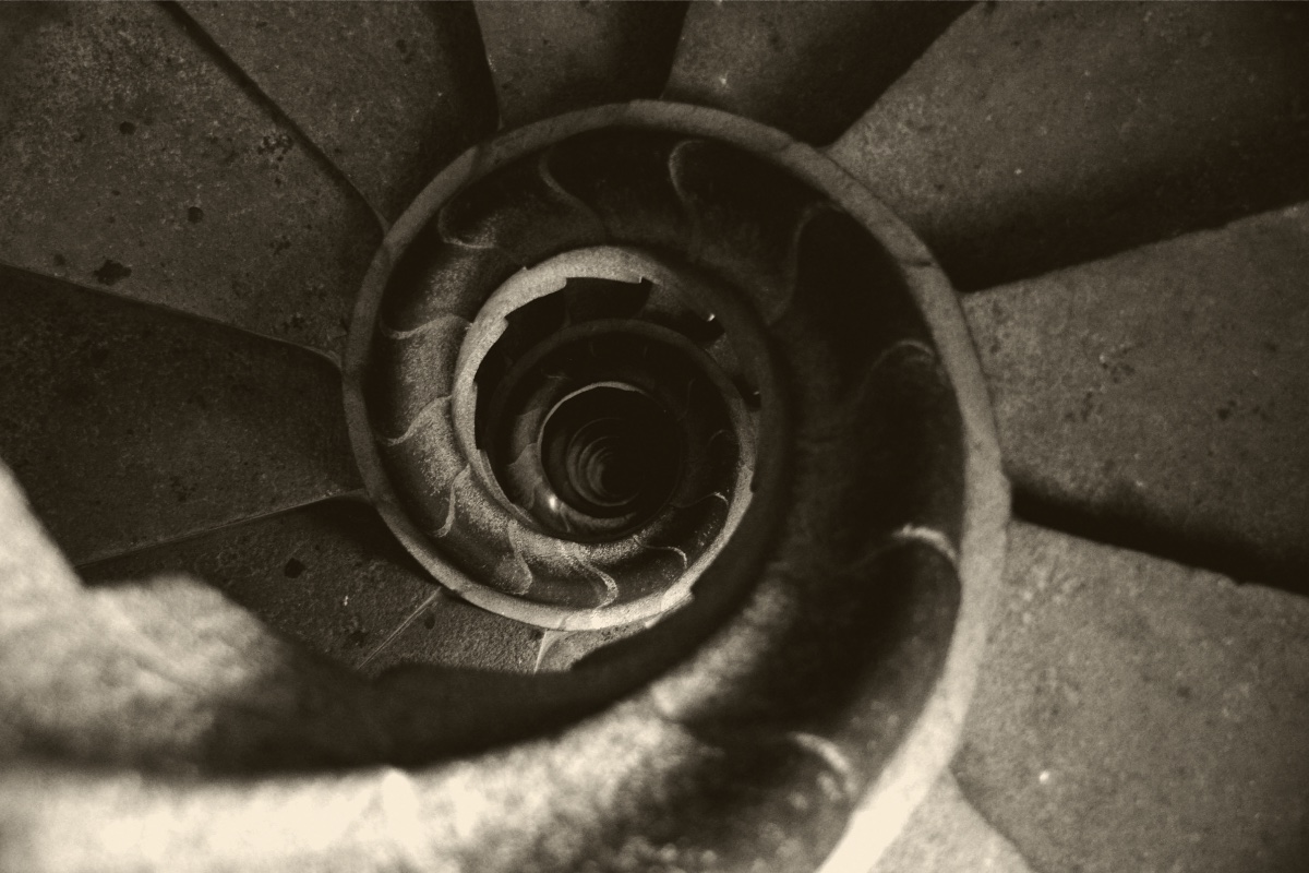 A spiral staircase made of concrete with a spiral design