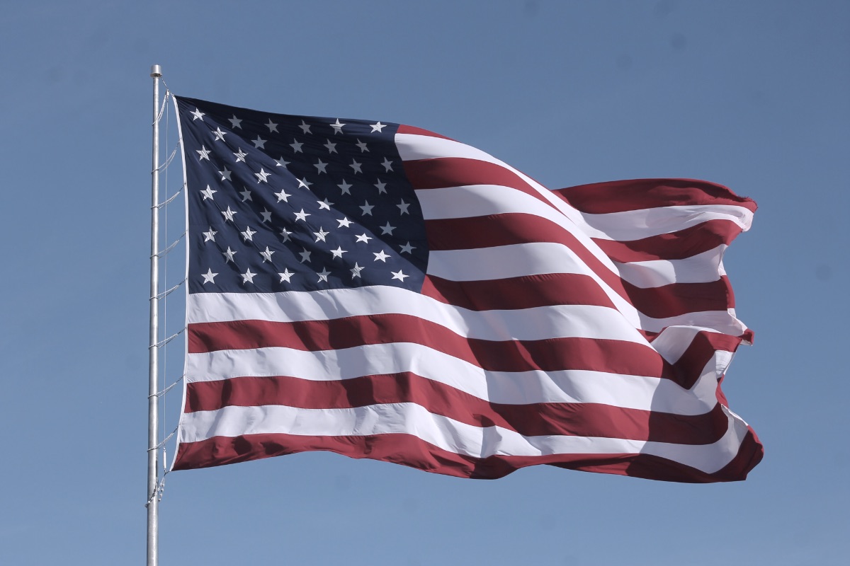 A United States flag flying from a pole
