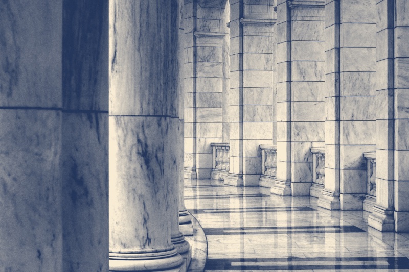 Minimalist photography of hallway between columns