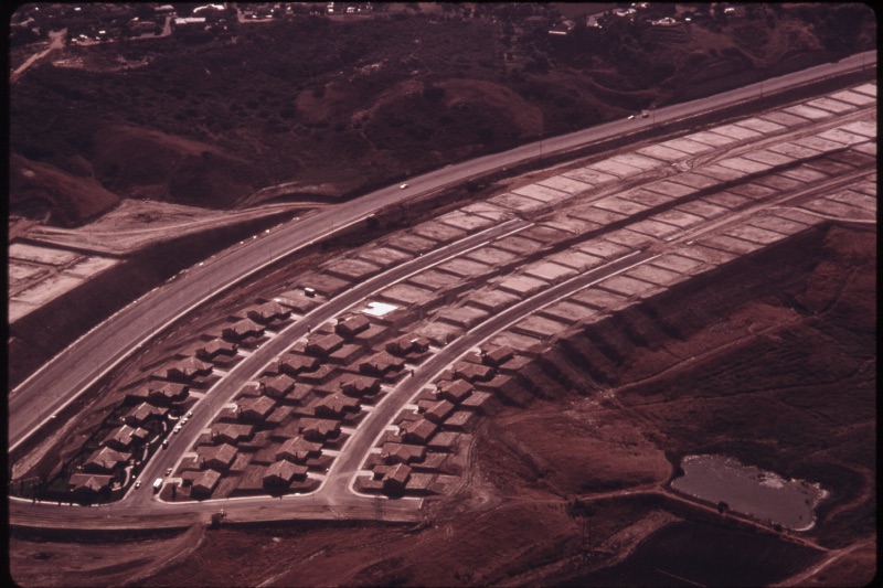 An aerial view of a housing development laid out in curving streets