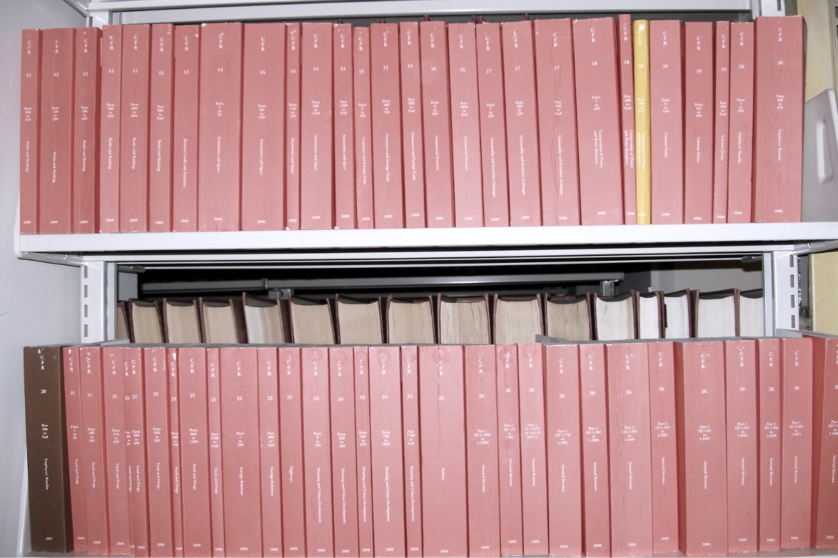 Bound volumes of the Code of Federal Regulations on a shelf