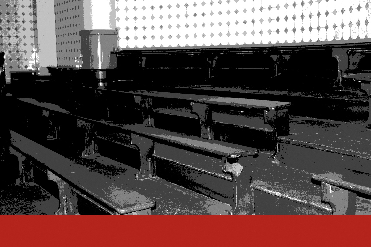 Rows of tiered wooden benches in a public hall, banded in the house treatment