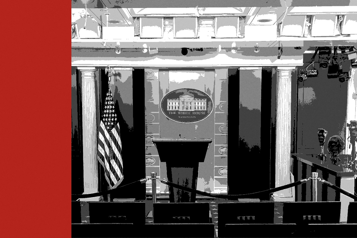 The James S. Brady Press Briefing Room at the White House, empty, with the podium roped off and rows of vacant seats