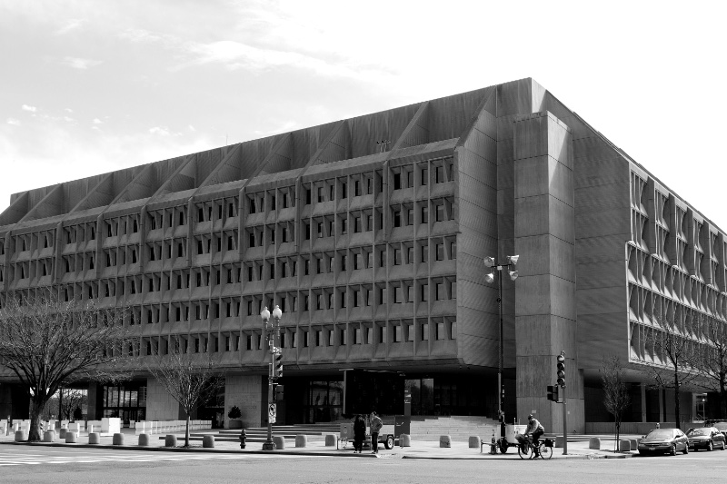 The concrete facade of the Hubert H. Humphrey Building in Washington seen from the street, in plain colour