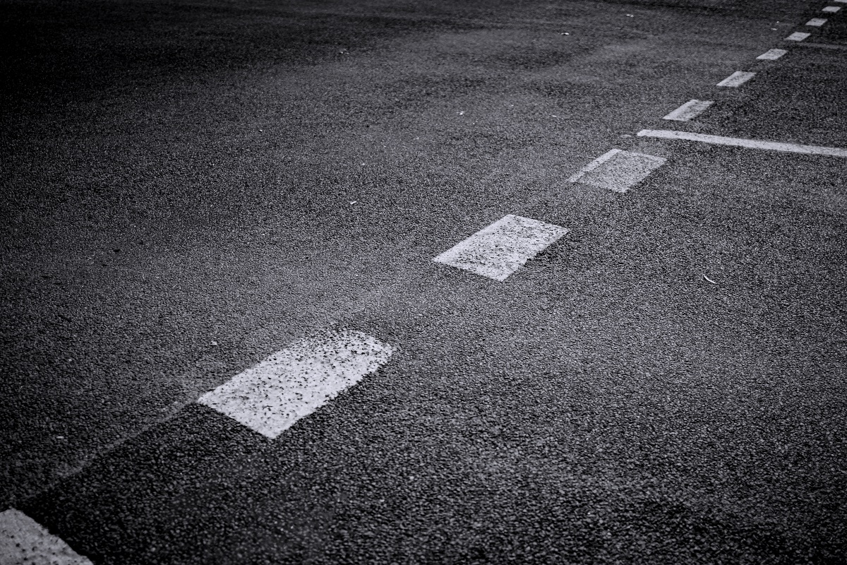 A black and white photo of an empty parking lot