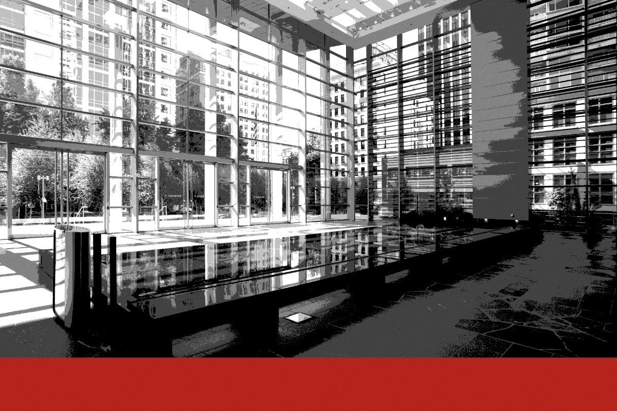The glass lobby of the federal courthouse in Seattle, a long dark reflecting pool in the foreground and city towers seen through the curtain wall, in near black and white with a flat red band along the foot of the frame