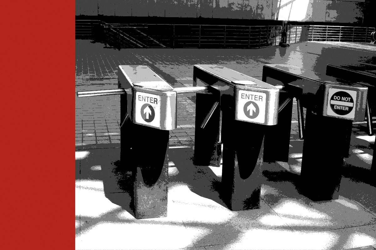 Turnstiles at an entry point, banded in the house treatment