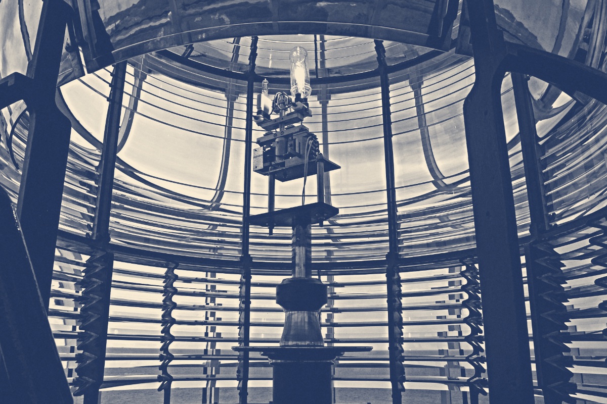 The interior of a Fresnel lighthouse lens, in a blue duotone