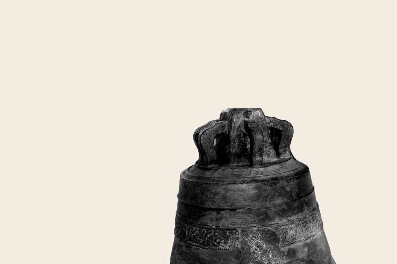 A weathered bronze church bell